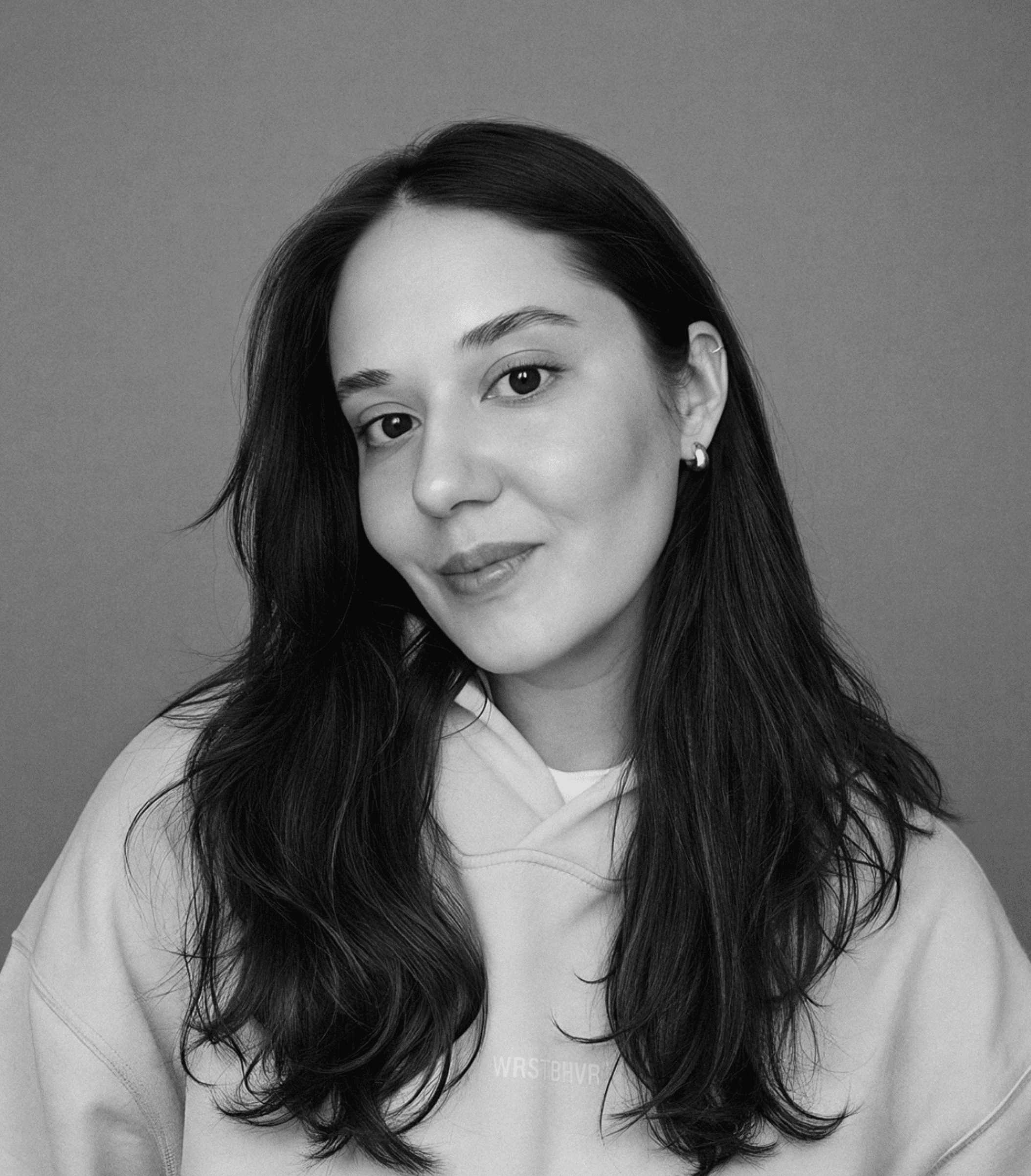 Black-and-white portrait of Zhenia looking at the camera
