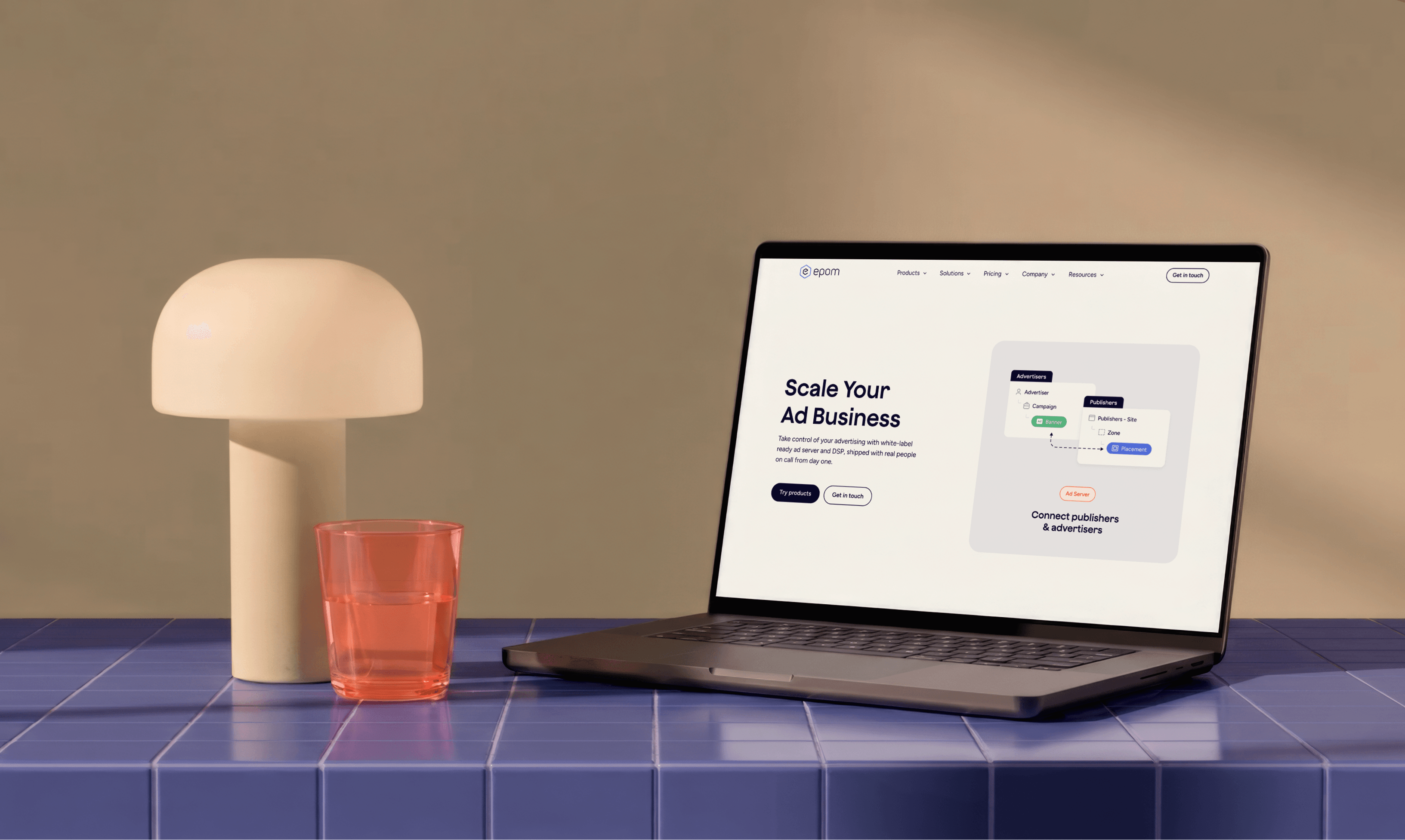 The Epom brand across a laptop, phone and print